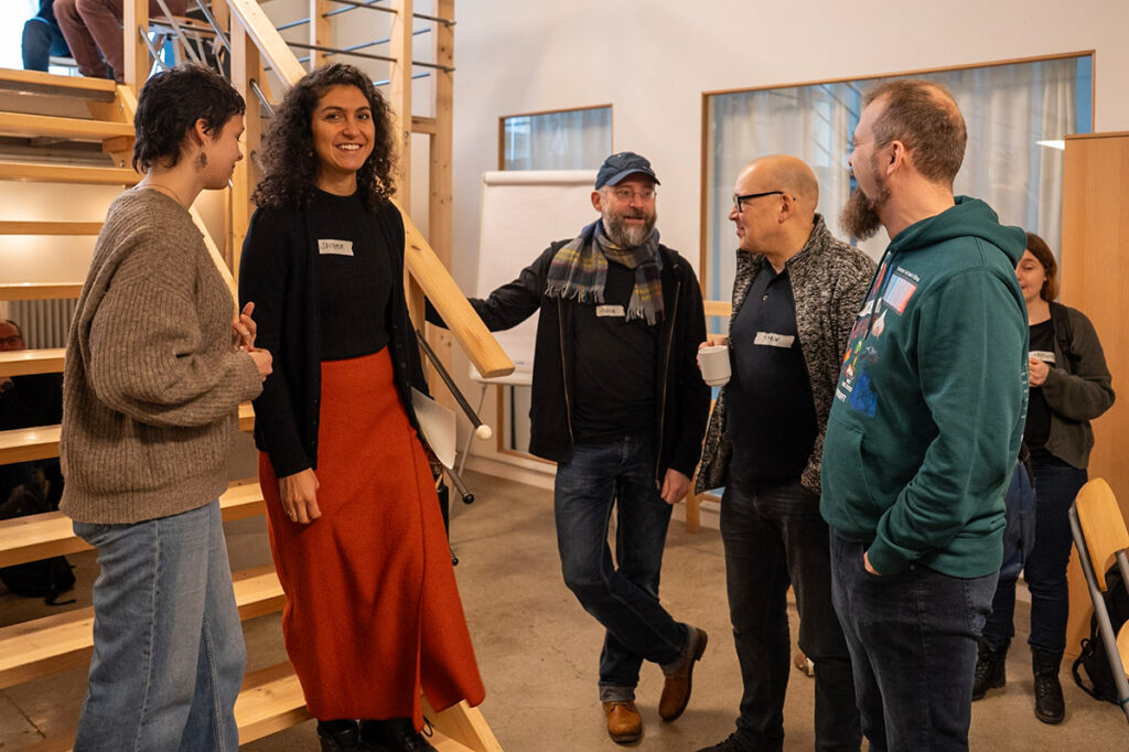 My colleagues Kathi, Shireen and I mingling with the first arrivals