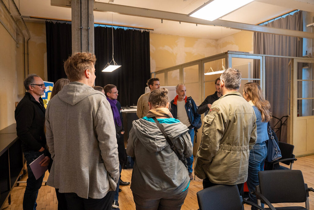 Workshop group debating.